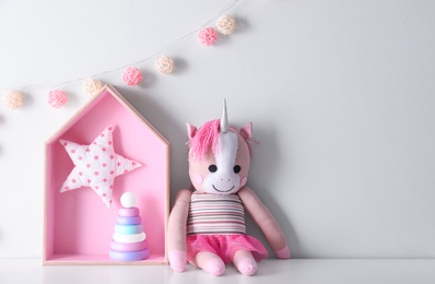 Photo of Cute toys on table, space for text. Interior design