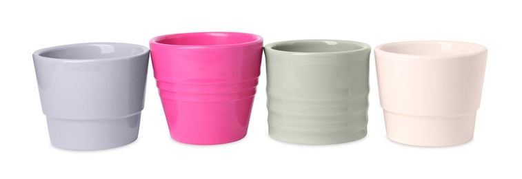 Photo of Many different empty ceramic flower pots on white background