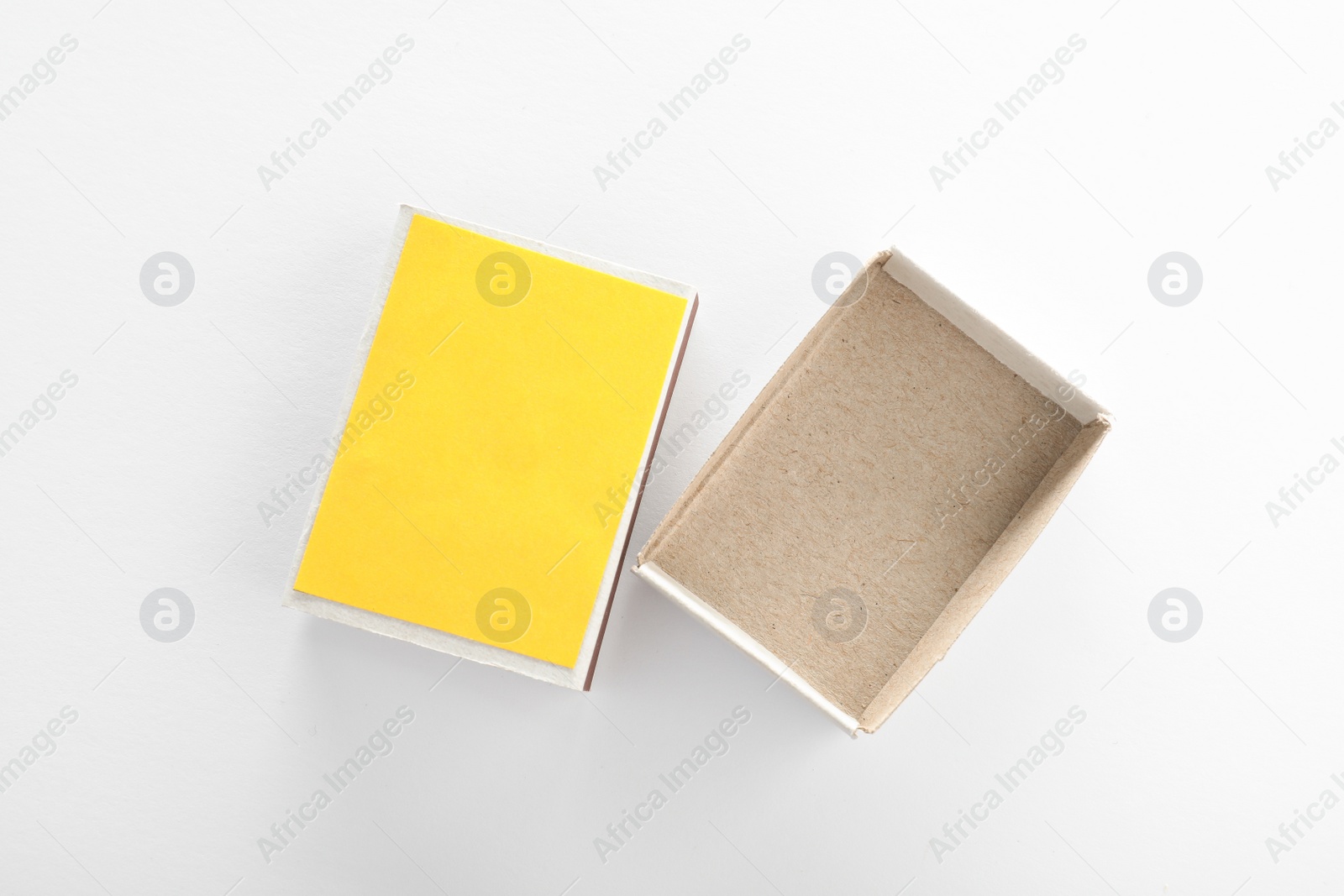 Photo of Empty matchbox on white background, top view. Space for design