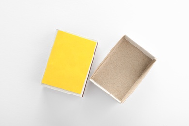 Photo of Empty matchbox on white background, top view. Space for design