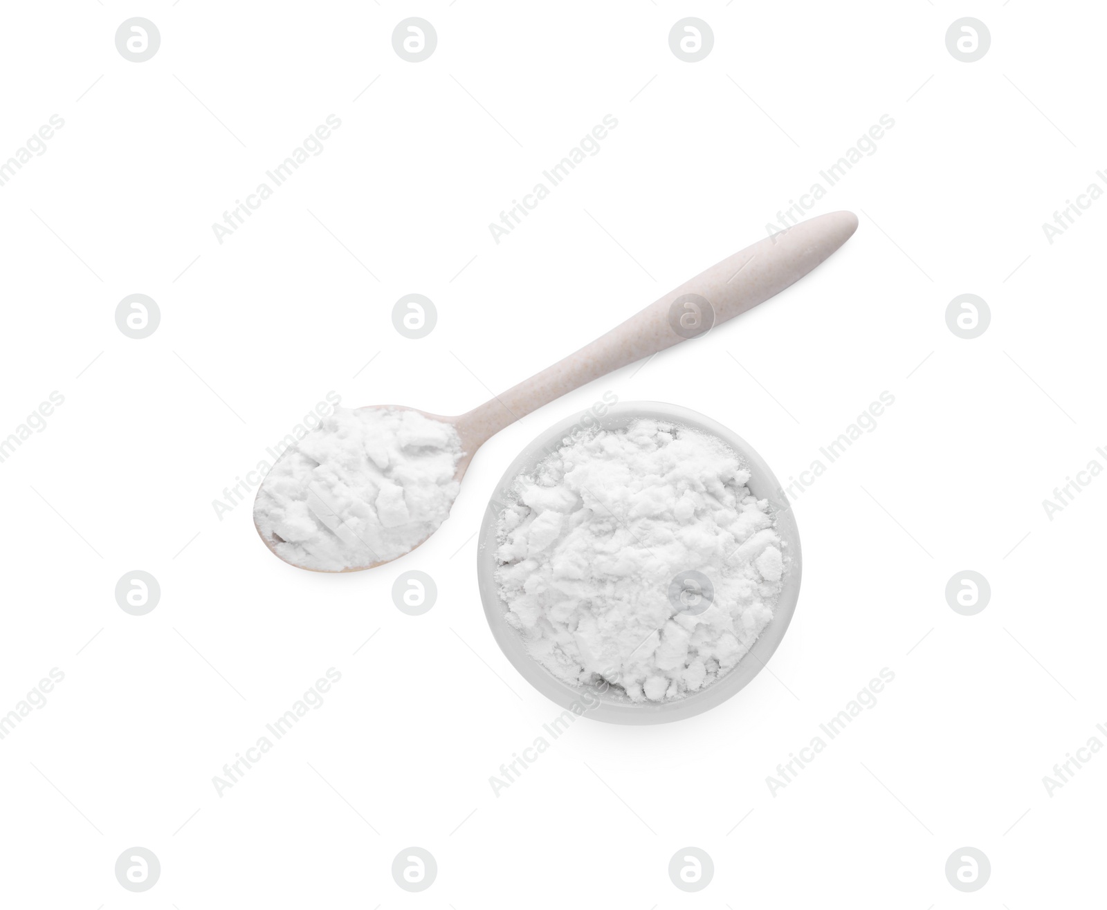 Photo of Bowl and wooden spoon of natural starch isolated on white, top view