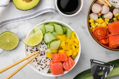 Photo of Delicious poke bowls with different ingredients on white marble table, flat lay