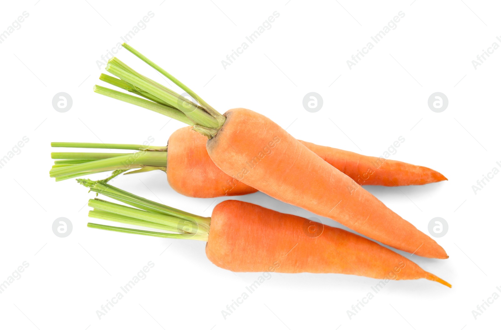 Photo of Pile of fresh ripe carrots isolated on white, top view