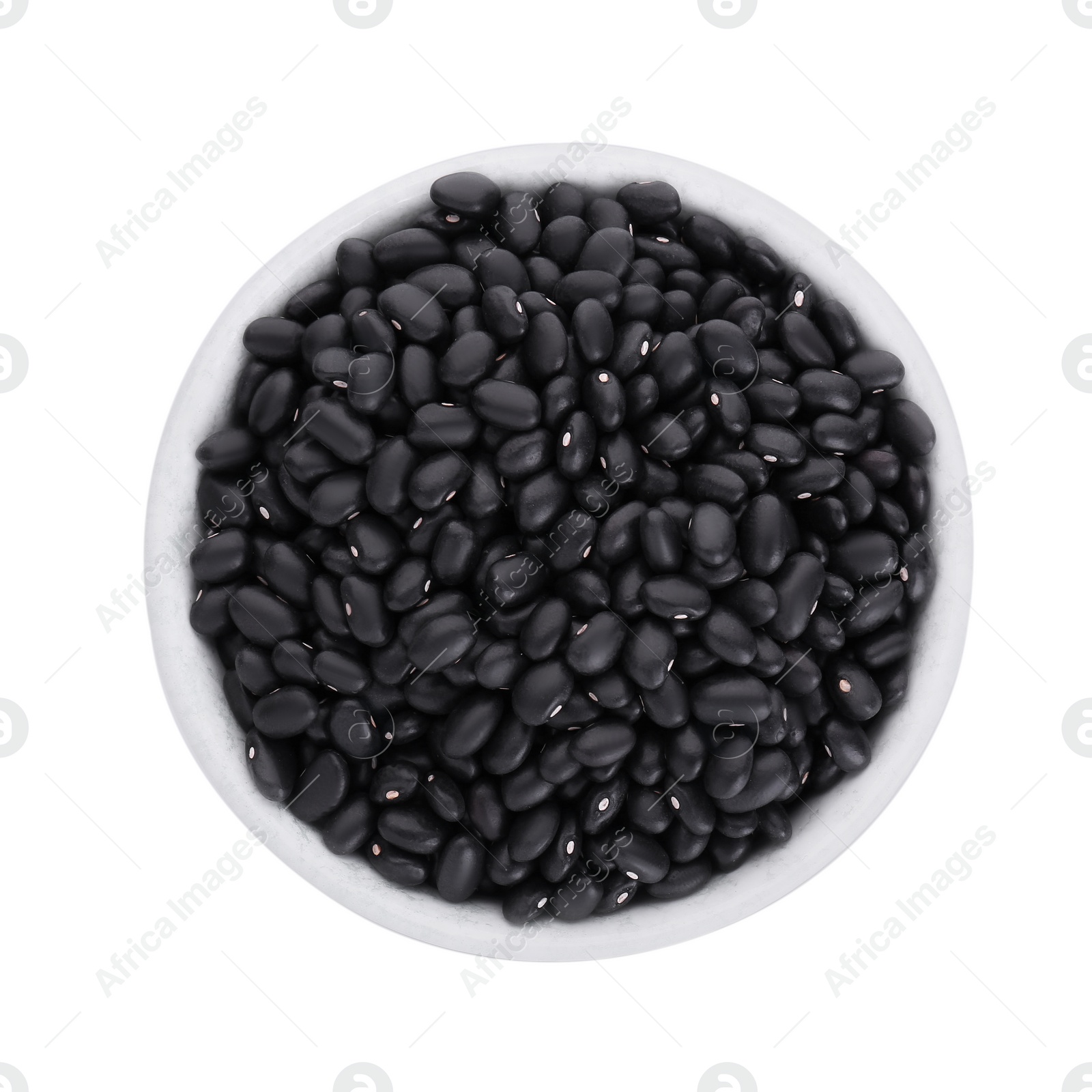 Photo of Bowl of raw black beans isolated on white, top view