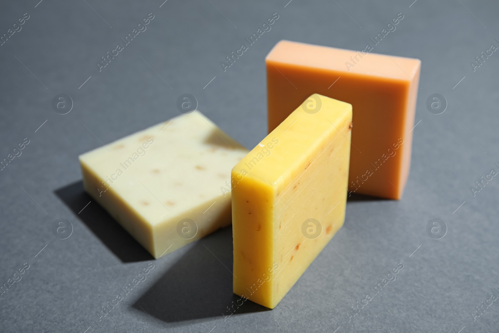 Photo of Hand made soap bars on grey background