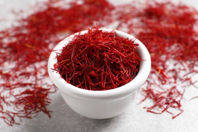 Photo of Dried saffron on grey table, closeup view