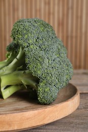 Fresh raw broccoli on table, closeup view