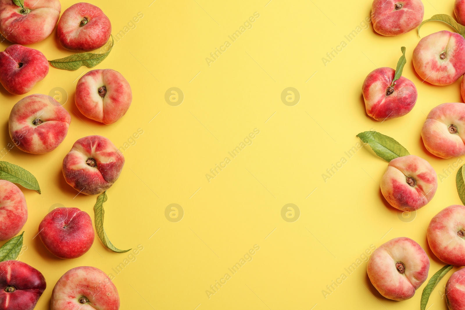 Photo of Fresh donut peaches on yellow background, flat lay. Space for text