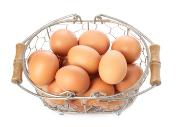 Chicken eggs in metal basket isolated on white