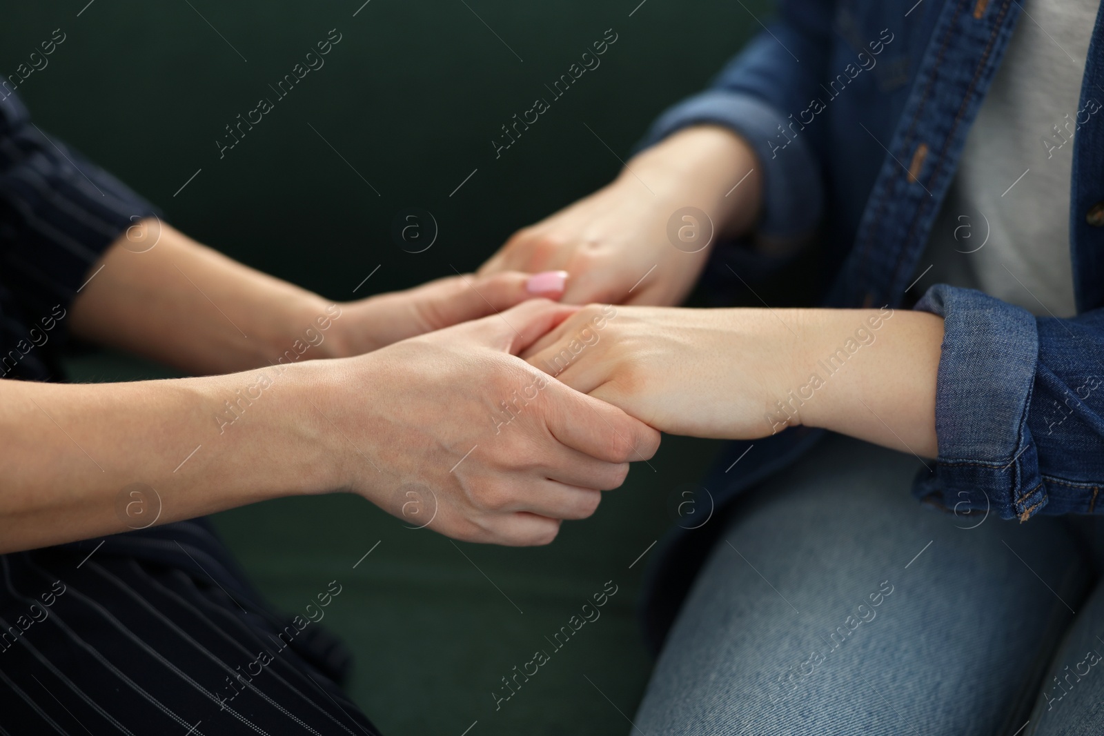 Photo of Psychotherapist working with patient in office, closeup
