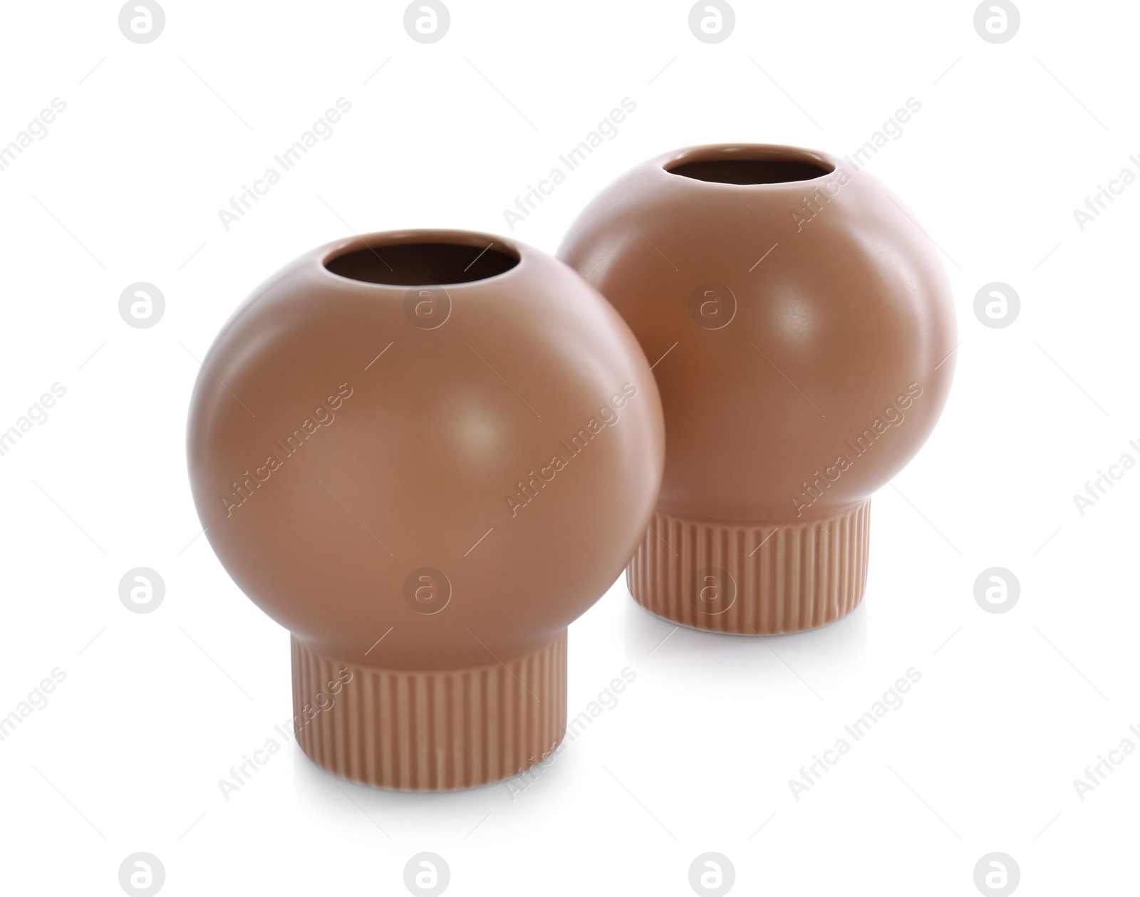 Photo of Stylish empty brown ceramic vases isolated on white