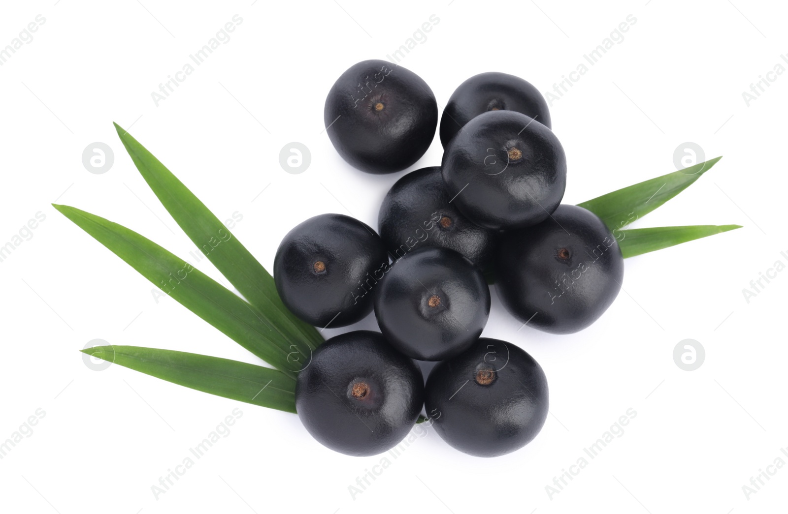 Photo of Pile of fresh ripe acai berries and green leaves on white background