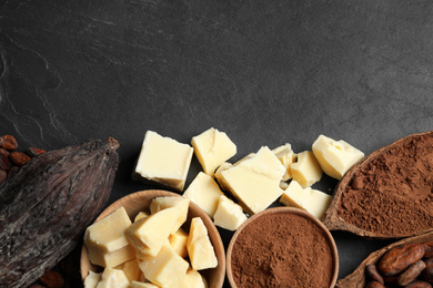 Photo of Flat lay composition with organic cocoa butter on black table. Space for text