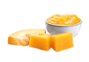 Photo of Frozen pumpkin puree cubes and fresh pumpkin isolated on white