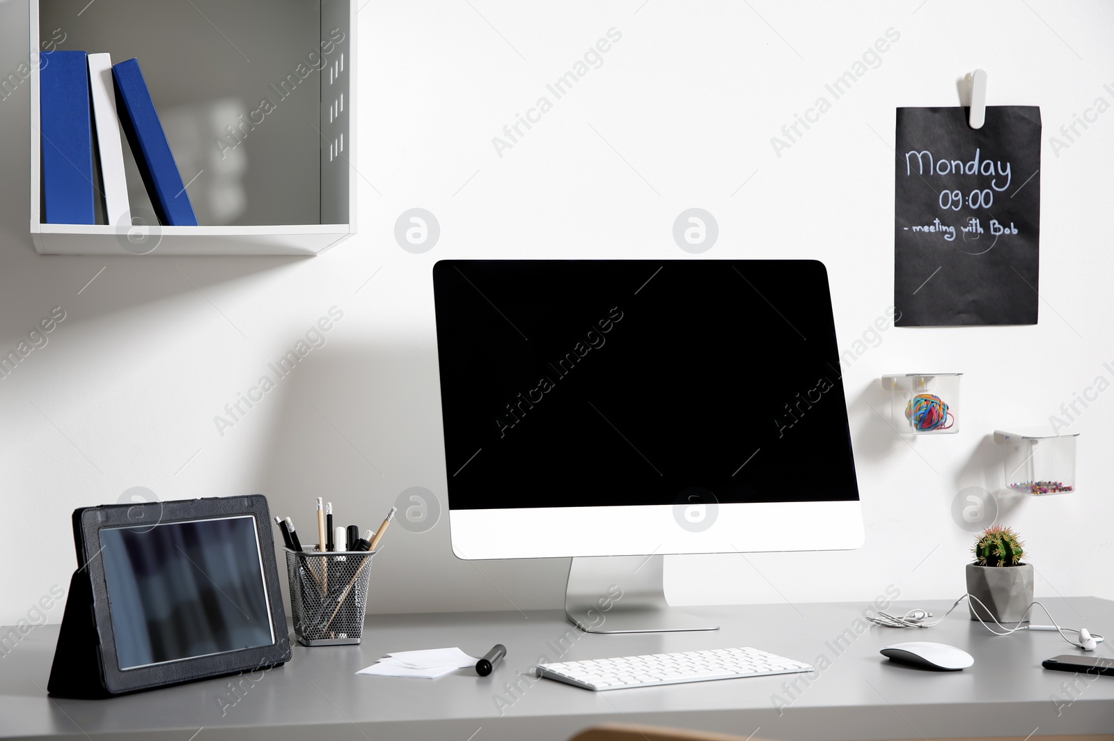 Photo of Modern interior of workplace with computer and accessories