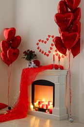 Stylish room with fireplace and Valentine's day decor. Interior design