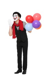 Funny mime artist with balloons screaming on white background