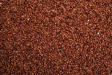 Heap of red quinoa as background, top view. Veggie seeds