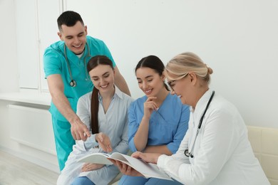 Photo of Team of professional doctors working together in clinic