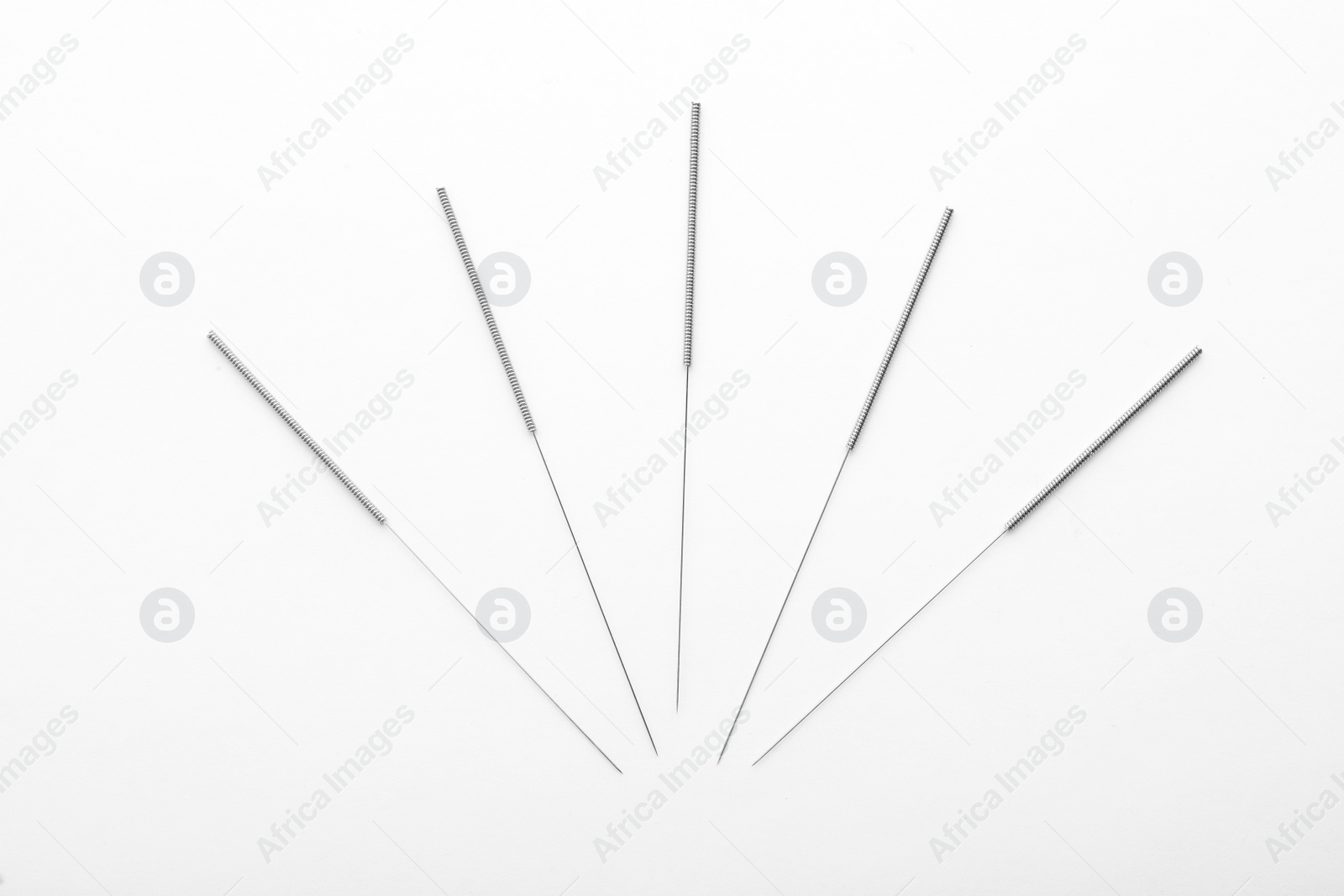 Photo of Needles for acupuncture on white background