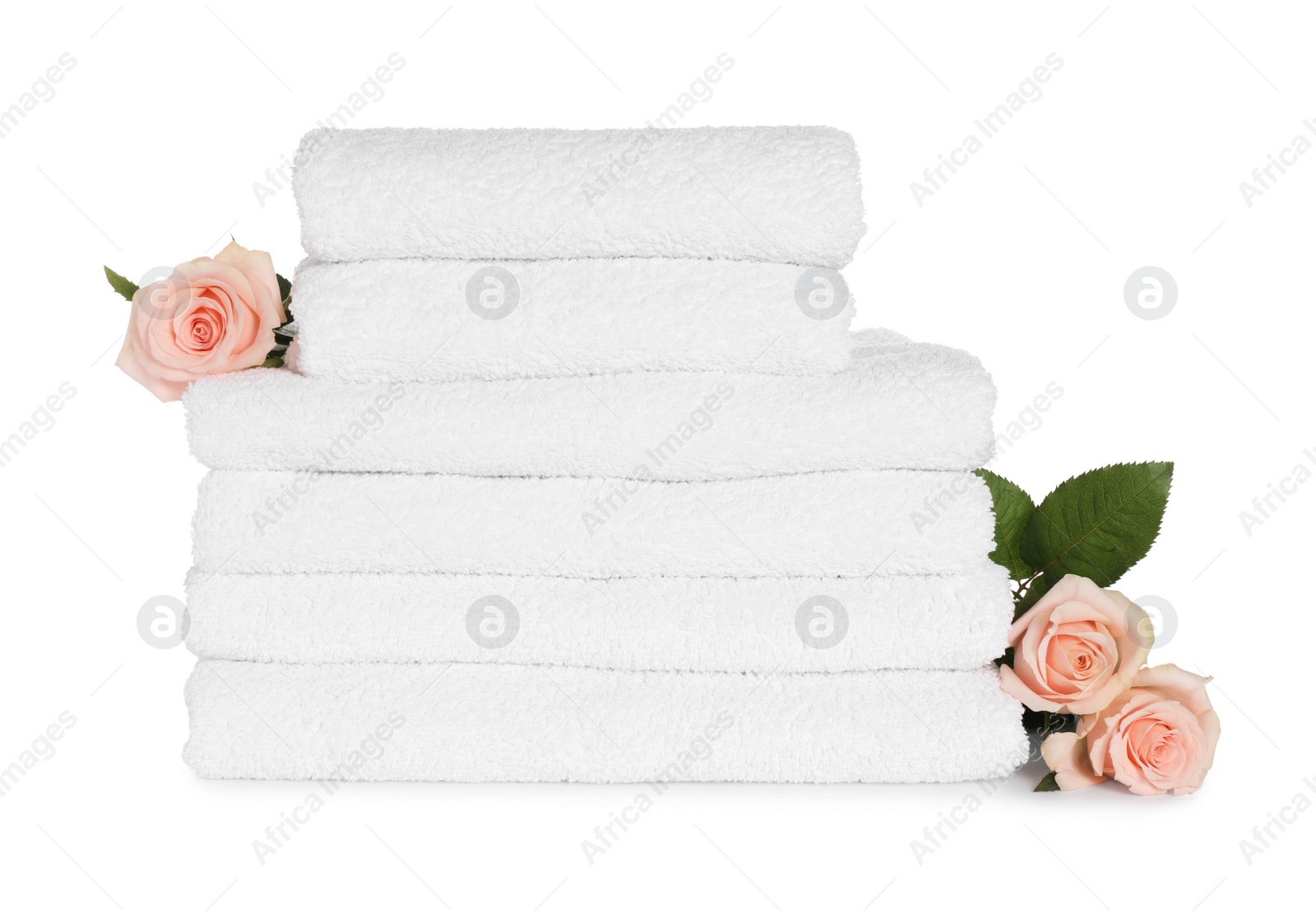 Photo of Stack of clean soft towels with flowers isolated on white