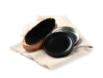 Photo of Shoe care accessories with cloth on white background