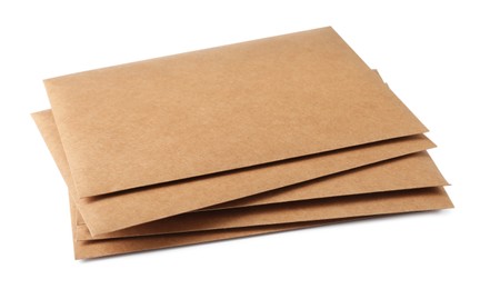 Photo of Stack of brown letters on white background