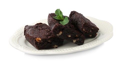 Photo of Delicious brownies with nuts and mint on white background