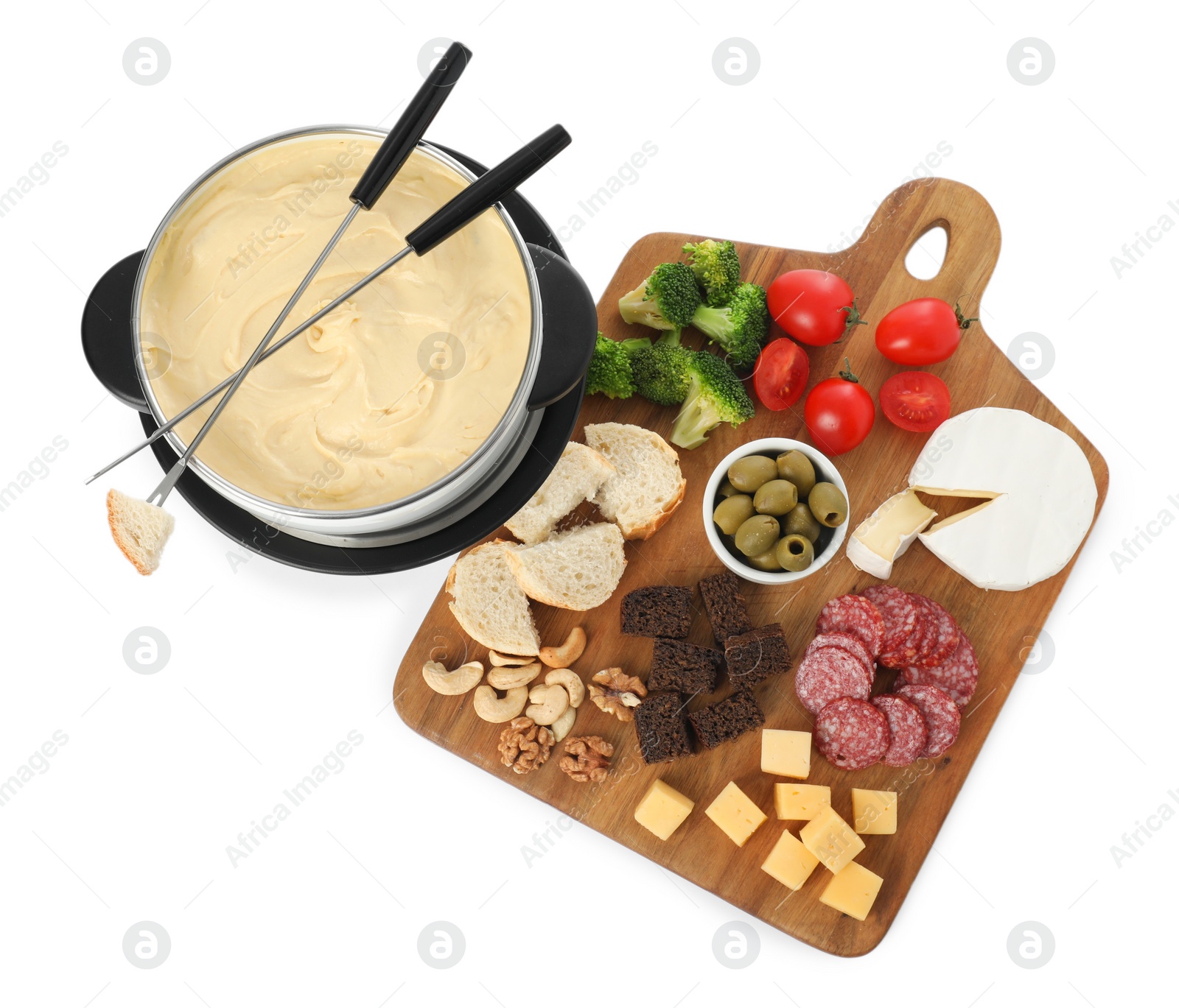 Photo of Fondue with tasty melted cheese, forks and different snacks isolated on white, top view