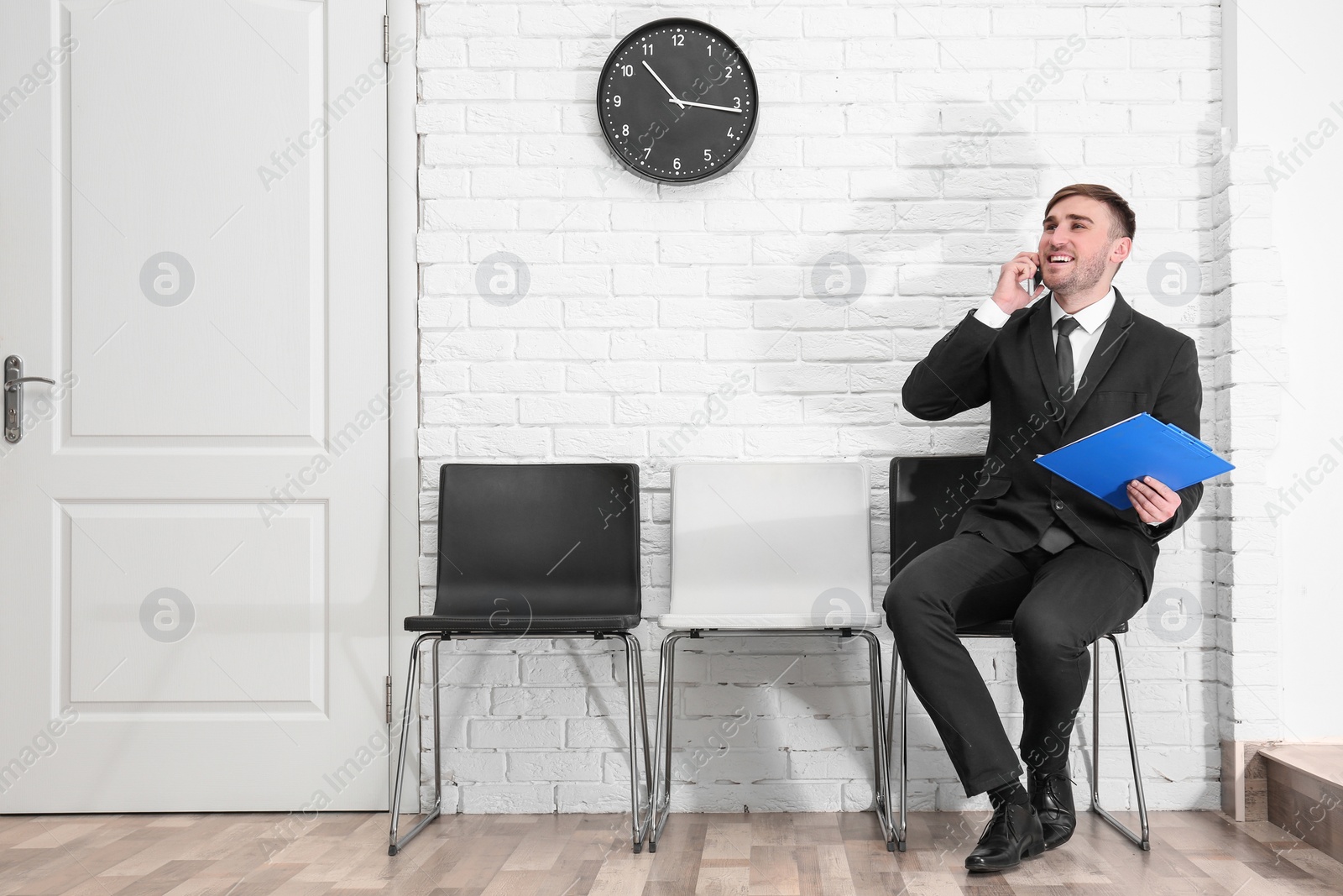 Photo of Young man waiting for job interview, indoors