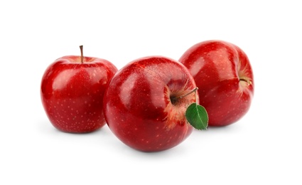 Photo of Ripe juicy red apples with leaf on white background