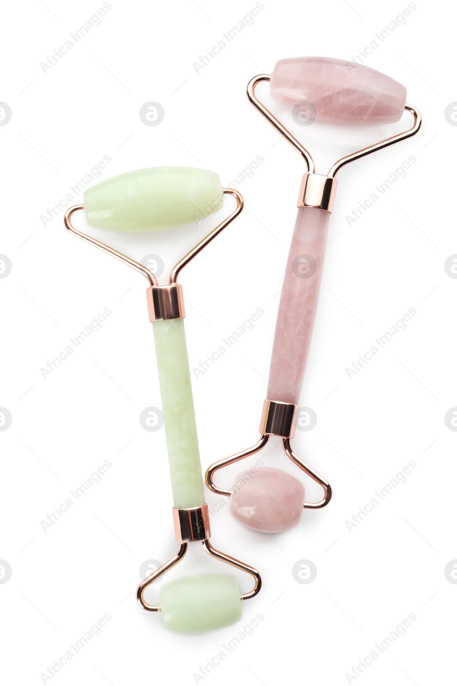 Photo of Different natural face rollers on white background, top view