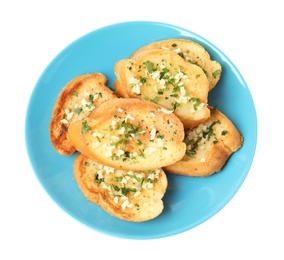 Plate with tasty homemade garlic bread isolated on white, top view