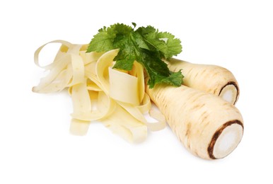 Photo of Whole and sliced fresh ripe parsnip with leaves on white background, closeup