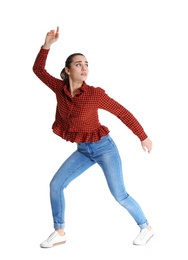 Young woman attracted to magnet on white background