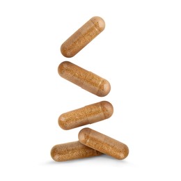 Image of Vitamin. Many capsules falling on white background