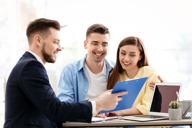 Young couple meeting with consultant in office