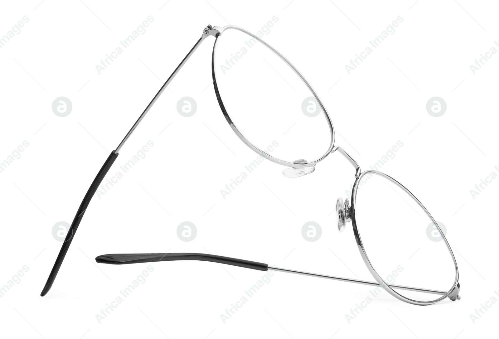 Photo of Stylish glasses with metal frame isolated on white