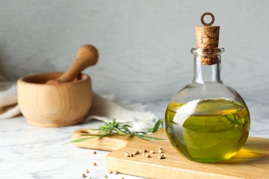 Photo of Composition with hemp oil on marble table