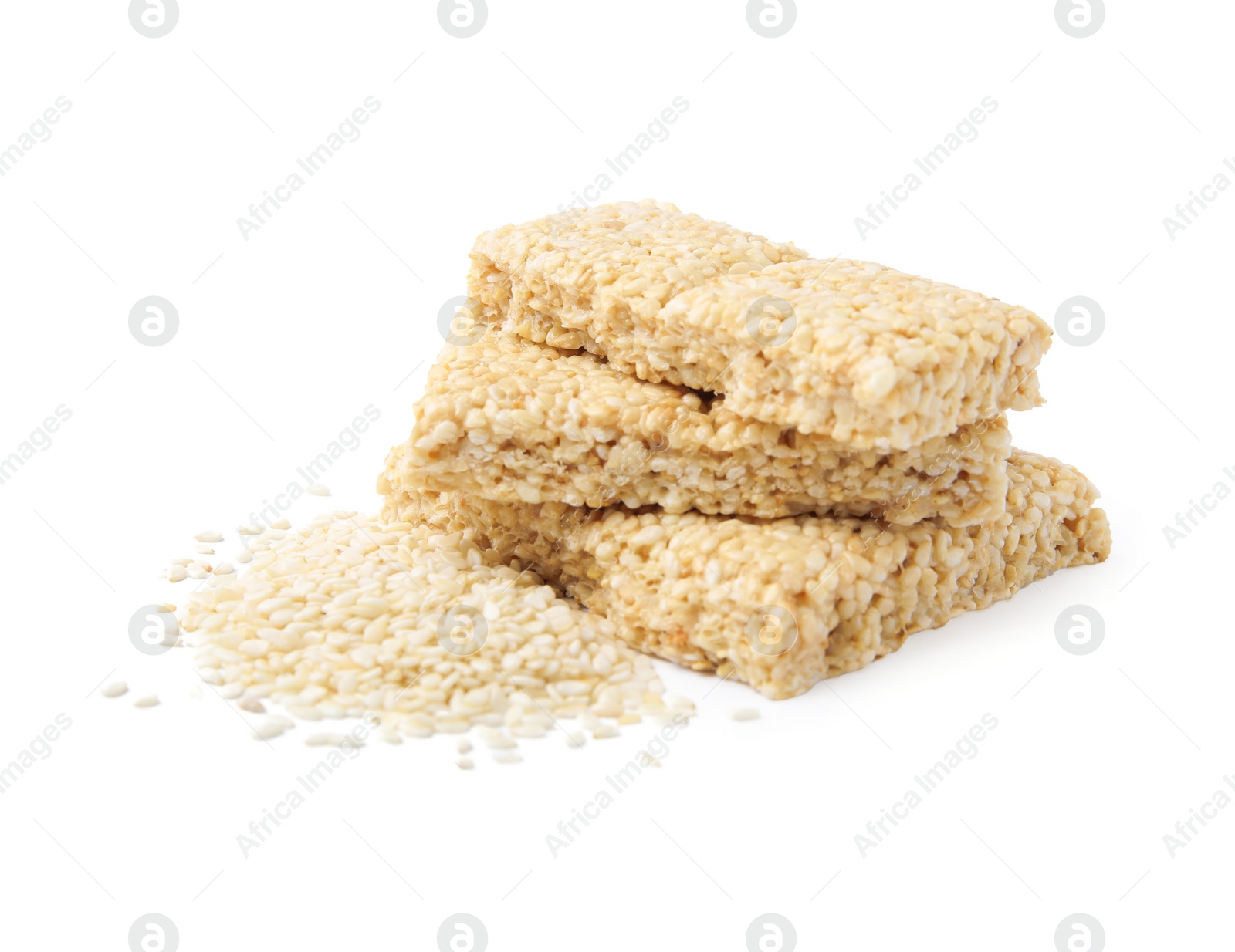 Photo of Delicious sweet kozinaki bars and sesame seeds on white background