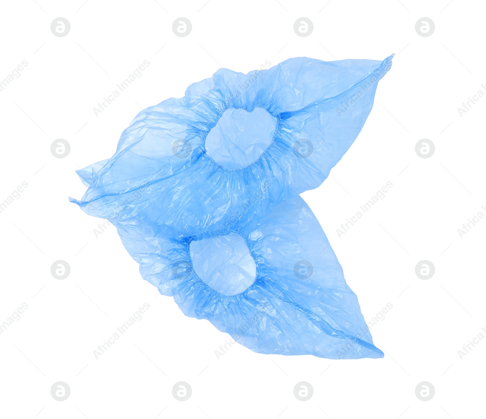 Photo of Pair of blue medical shoe covers isolated on white, top view