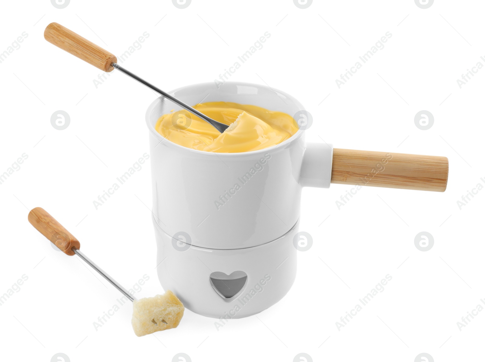 Photo of Pot of tasty cheese fondue and forks isolated on white