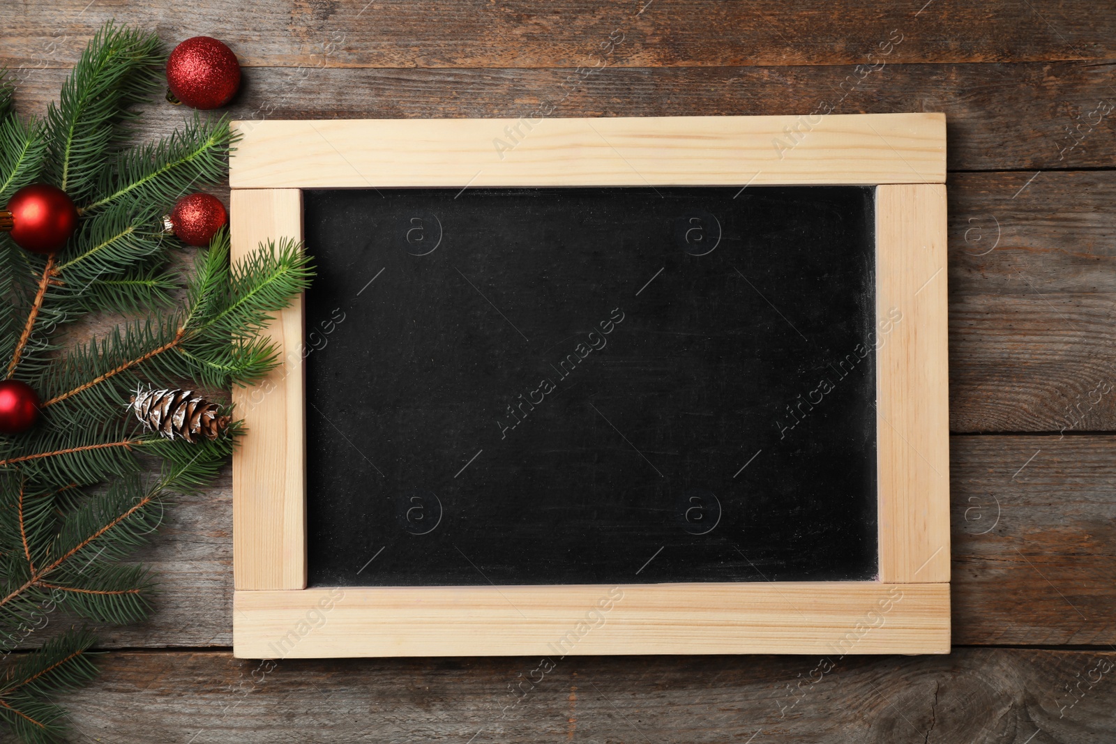 Photo of Chalkboard and decor on wooden background, top view. Christmas countdown