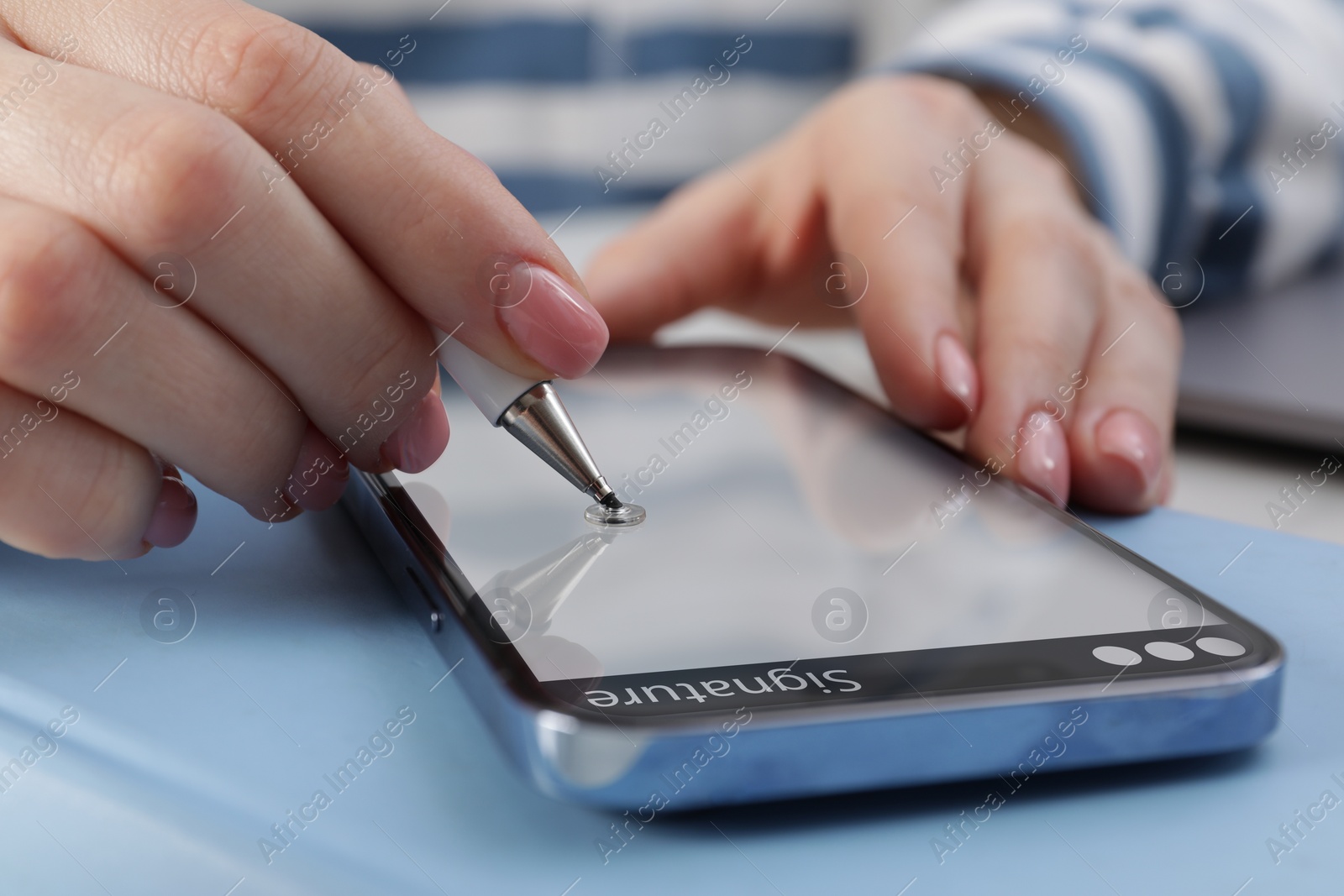 Image of Electronic signature. Woman using stylus and mobile phone, closeup