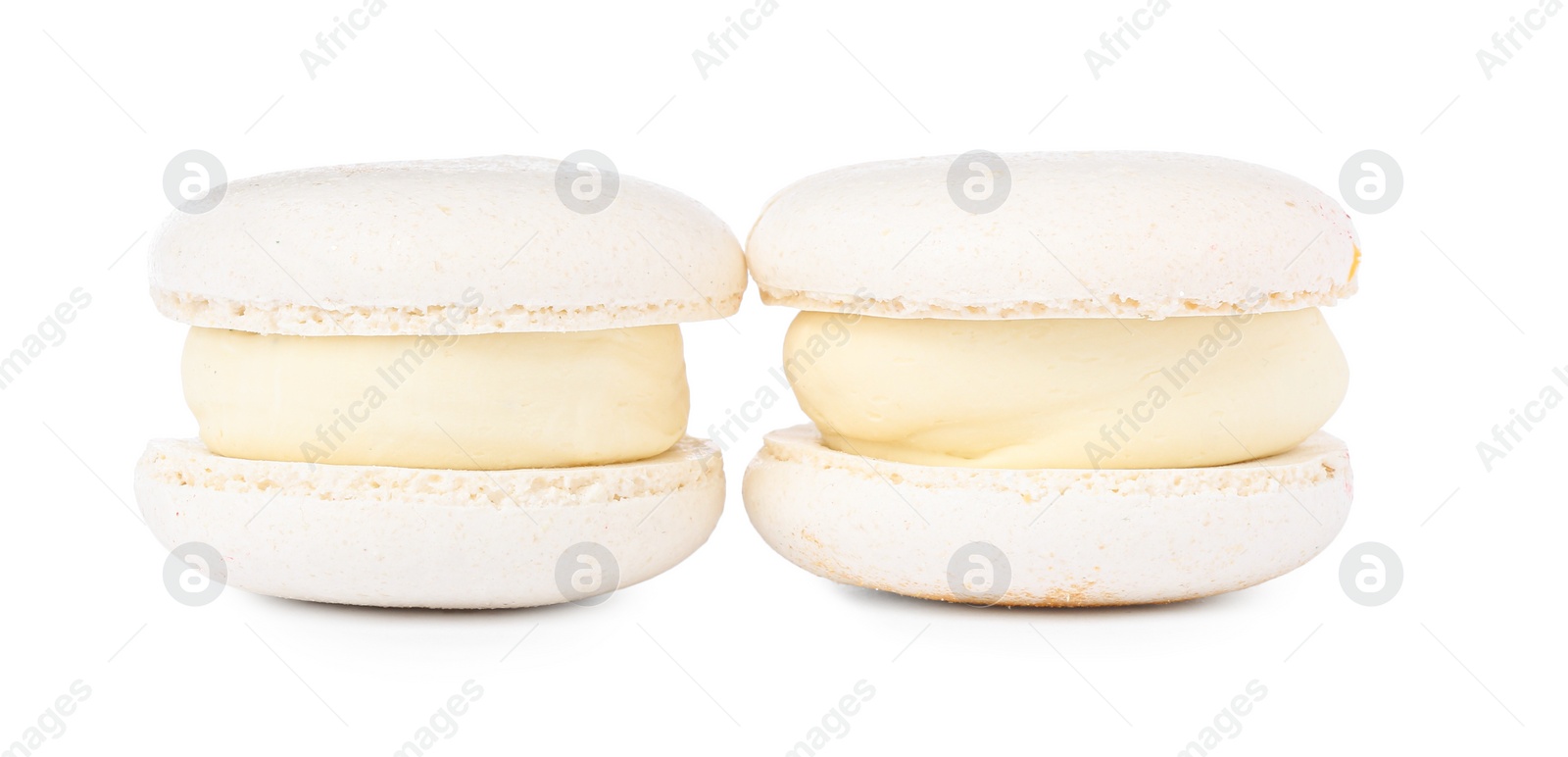 Photo of Two delicious sweet macarons isolated on white