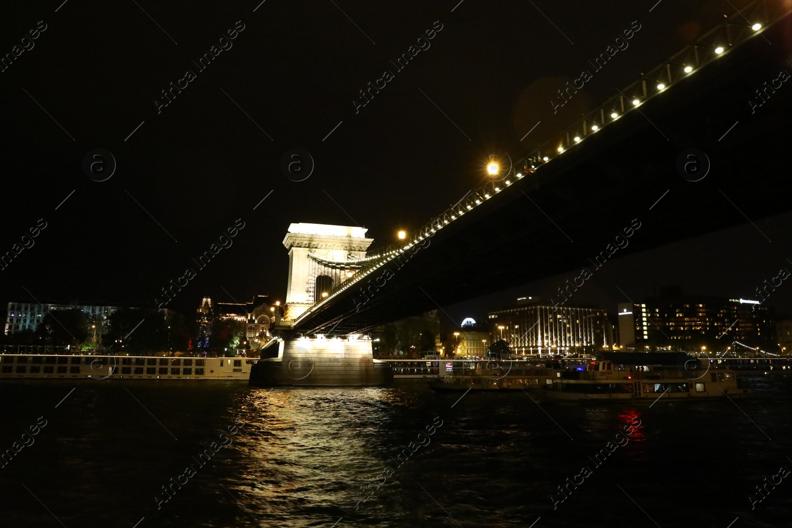 Photo of BUDAPEST, HUNGARY - APRIL 27, 2019: Beautiful night cityscape with illuminated Szechenyi Chain Bridge across Danube river