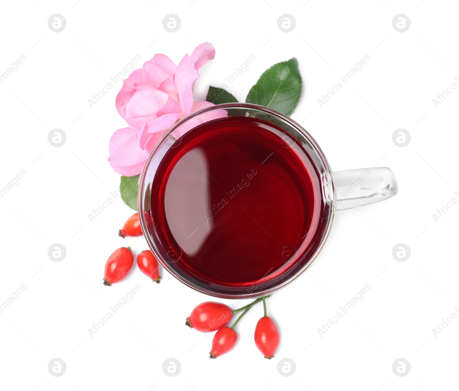 Photo of Aromatic rose hip tea, flower and fresh berries on white background, top view