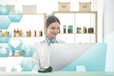 Professional pharmacist working with computer in drugstore