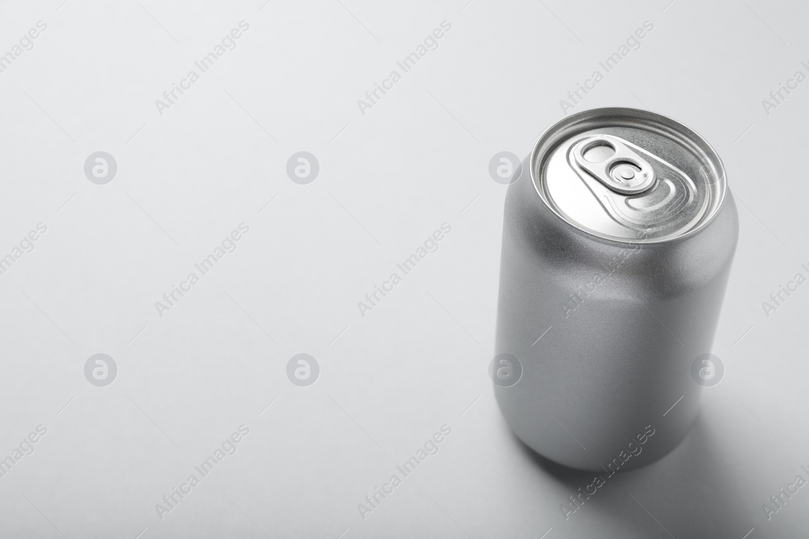 Photo of Can of energy drink on white background. Space for text