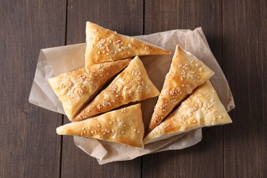 Photo of Delicious puff pastry on wooden table, top view